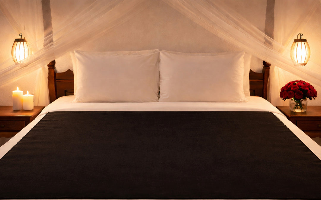 The black absorbent backing to the reversible Moonstone Organic Cotton Venus Mat waterproof bed mat