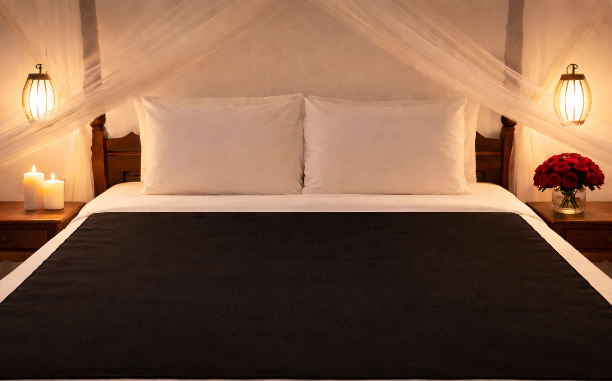 The black absorbent backing to the reversible Moonstone Organic Cotton Venus Mat waterproof bed mat