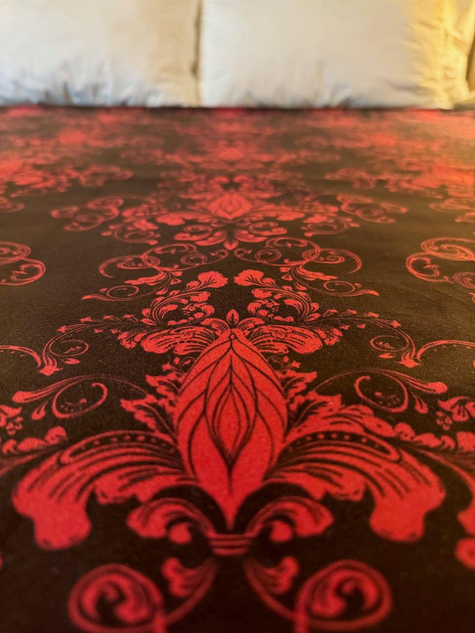 Her Majesty Venus Mat features royal feminine motif repeated on absorbent bed mat.