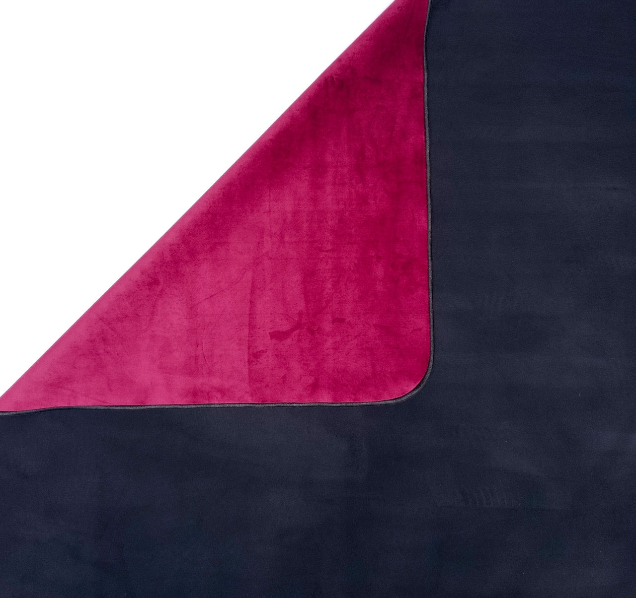 Detail of folded velvet Ruby Venus Mat over ultra-absorbent black backing