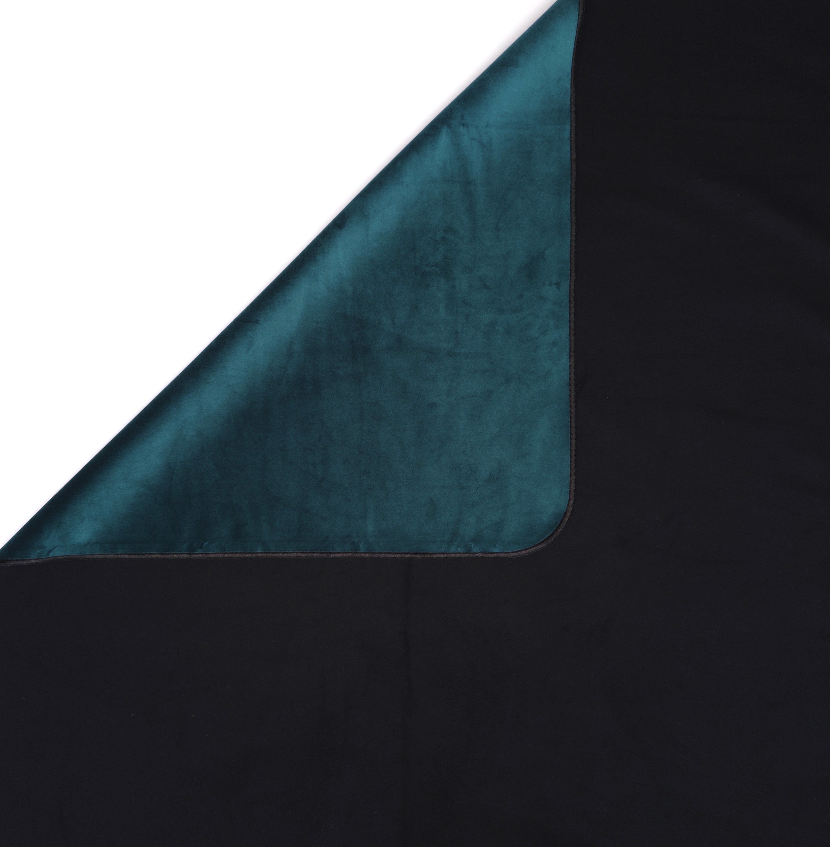 Detail of Emerald green velvet folded over ultra-absorbent black backing of the Emerald Venus Mat waterproof bed mat.