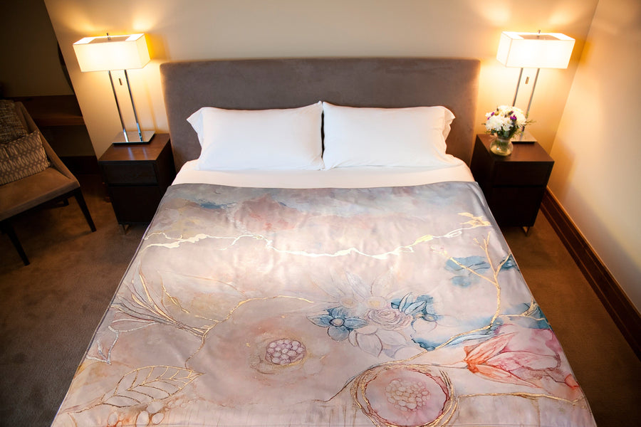 Flower Dakini Venus Mat Throw a cascade of abstract flowers on a pale gray background. Waterproof, Washable sex mat. Venus Mats keep the bedding clean when things get wonderfully wet.