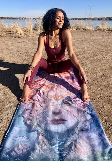 a woman sitting on top of fertility hot yoga venus mat squirt mat